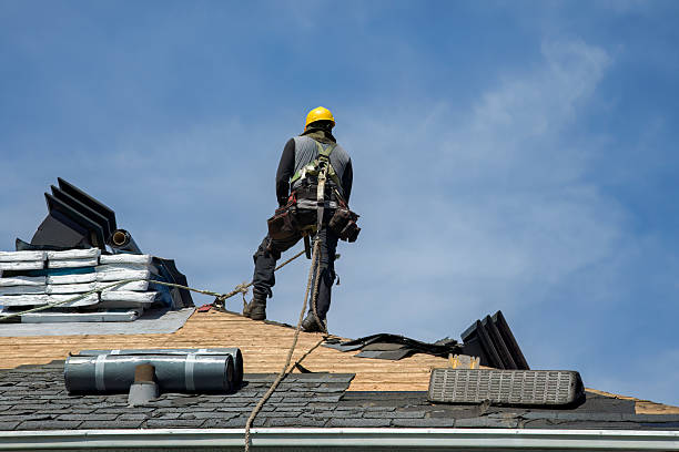 Professional Storm Damage Roof Repair technician working in Wellsville, MO